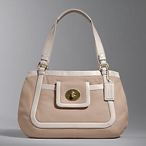 The new Cricket Satchel from Coach.  In this nice, light, neutral color for spring and summer.  I actually sent pics of similar bags from lesser-known companies, but Justin couldn't find them in the stores, so he improvised with this, which I like WAAAAYYYY better than the ones I originally picked out.