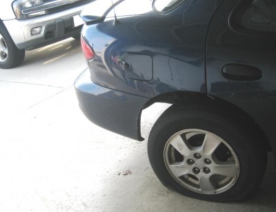 img_0389_cropped This one’s a two-fer…you get to see not only my lovely flat tire, but also the damage I inflicted upon my truck.